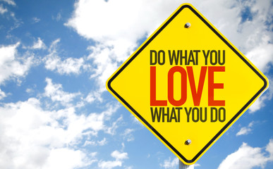 Do What You Love What You Do sign with sky background