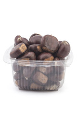 Box or punnet of fresh organic chestnuts isolated on white background
