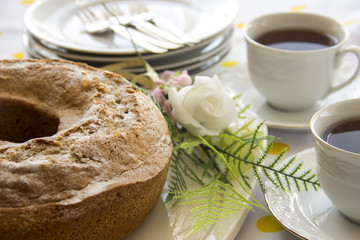 Homemade ring cake with pimento and cup of tea for teatime in afternoon