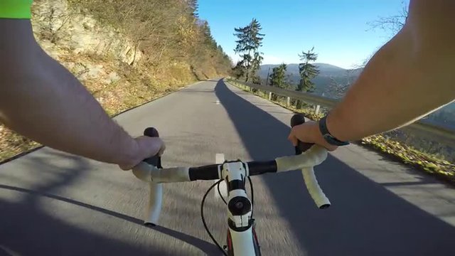 4K POV Cyclist speeding on the mountain road on sunny day
