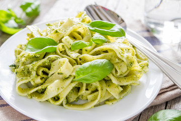Pesto pasta on white plate