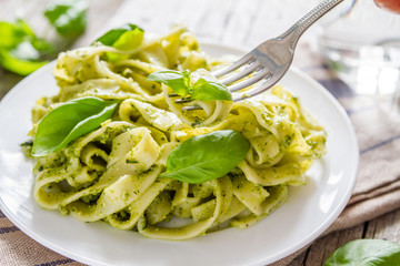 Pesto pasta on white plate