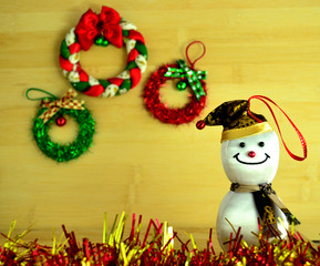 Snowman on wood background