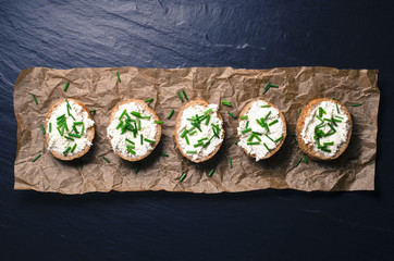 Mini sandwiches on dark background. Top view