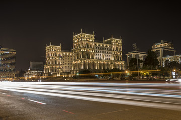 Fototapeta na wymiar Baku government house night view with traffi lights
