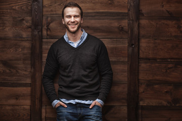 young handsome smiling man in urban background