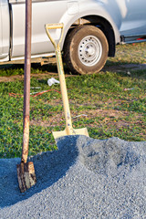 Shovel on a heap of gravel