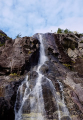 Obraz premium The waterfall Hengjanefossen seen from a boat in Lysefjord in norway