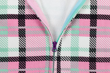 Open zipper on old colorful cloth