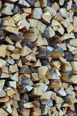 Pile of chopped fire wood, vertical background