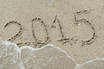2015 year written in sand beach