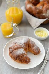 delicious breakfast with fresh croissants and orange juice
