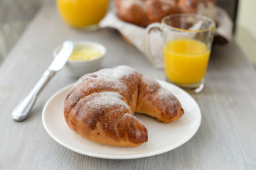 delicious breakfast with fresh croissants and orange juice