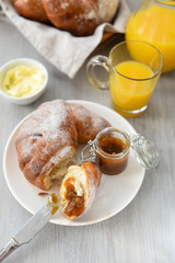 delicious breakfast with fresh croissants and orange juice