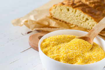 Corn bread cut in peaces on white wood background