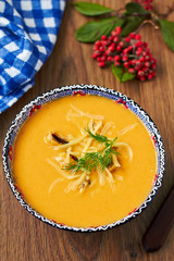 Pumpkin soup with mussels and cheese, top view