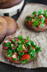 Italian tomato bruschetta with chopped vegetables, herbs and oil