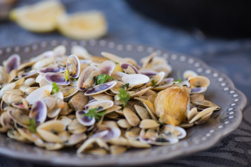 Stir fried clams with roasted paste,garlic, lemon, cilantro
