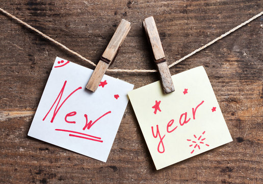 New Year card on wooden surface