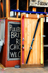 Creative cafe owner uses and recycles four skis to frame door of his restaurant.