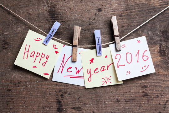 Happy New Year card on wooden surface