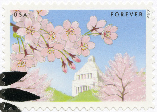 USA - 2015: National Diet Building in Tokyo with cherry trees