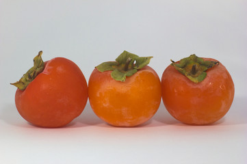 close-up of fabulous persimmon orange and green