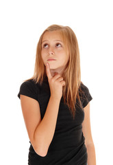 Young girl holding finger on chin.