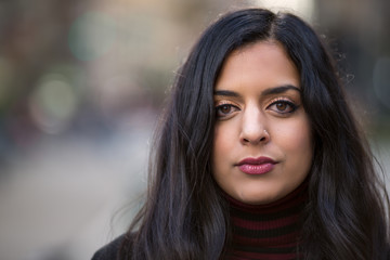 Indian woman in city serious face portrait