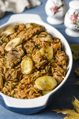 Rice with meat and bananas in tomato sauce   
