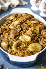 Rice with meat and bananas in tomato sauce   