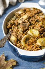Rice with meat and bananas in tomato sauce   