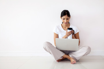 elegant indian girl looking at laptop screen