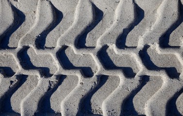 Reifenabdruck im Sand