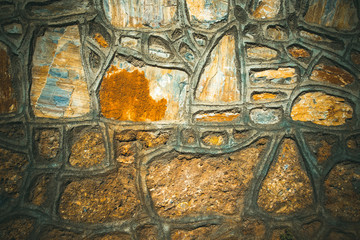 Fototapeta na wymiar Fragment of stone texture wall or fence for natural material bac