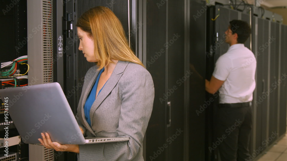Poster technicians working in the server room