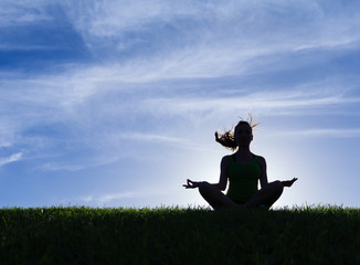 Woman meditating in a yoga pose