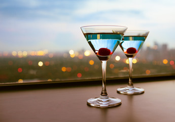 Martini drinks with a city view. 