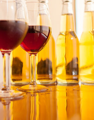 Red wine glass and glass of light beer
