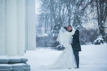 Bride and groom walking on the European city