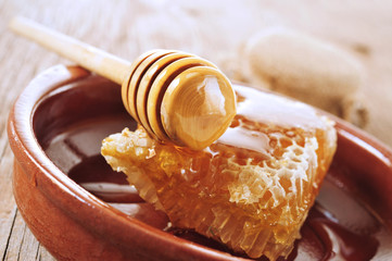honeycomb with honey on a wooden surface