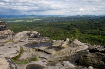 Fototapeta na wymiar View from hill Grosser Zschirnstein in Saxon Switzerland in Germany to Ruzovsky vrch and Luzicke hory in Czech republic.