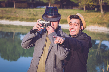 Fototapeta premium Two friends are taking a photograph outdoor 