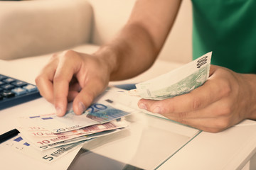 Calculating money, close up