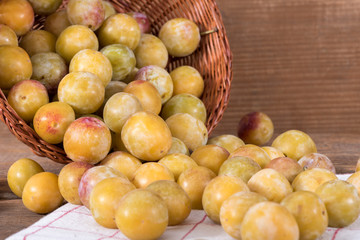 Fresh mirabelles with basket