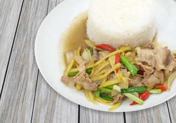 Fried fresh ginger with pork and vegetable eat with white cooked rice