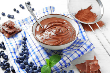 Beautiful composition with chocolate cream and blueberries