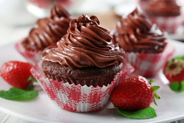 Chocolate cupcakes on plate closeup