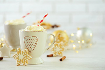 Beautiful composition with cups of cappuccino and Christmas cookies