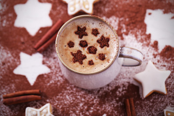 Beautiful composition with cup of cappuccino and Christmas cookies